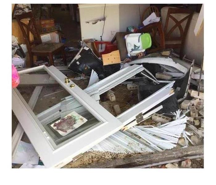 The home of a SERVPRO of Galveston Island / Lake Jackson customer after a car drove through their home during the night.
